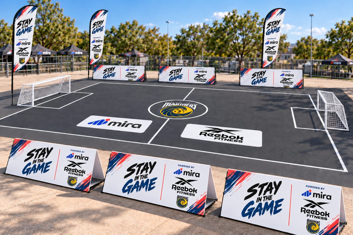 The Stay in the Game 3x3 court set up with feather flags and partner signage